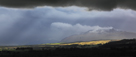 Storm clouds and hail approaching Blencathra, viewed from Penrith, Cumbria