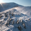 Swirral Edge Helvellyn, ice, sun, spindrift and rocks, Lake District