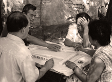 People playing mahjong in  a street in Beijing hutong, China, 2000